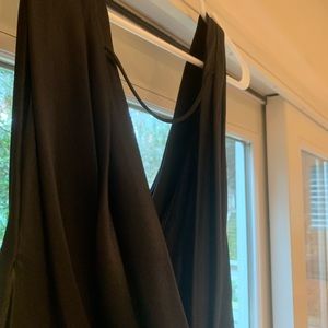 Black silk cocktail dress with draped back. Perfect for holiday parties.